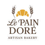 Logo de Le Pain Doré, una panadería artesanal, con imágenes de un croissant y espigas de trigo en un diseño elegante.